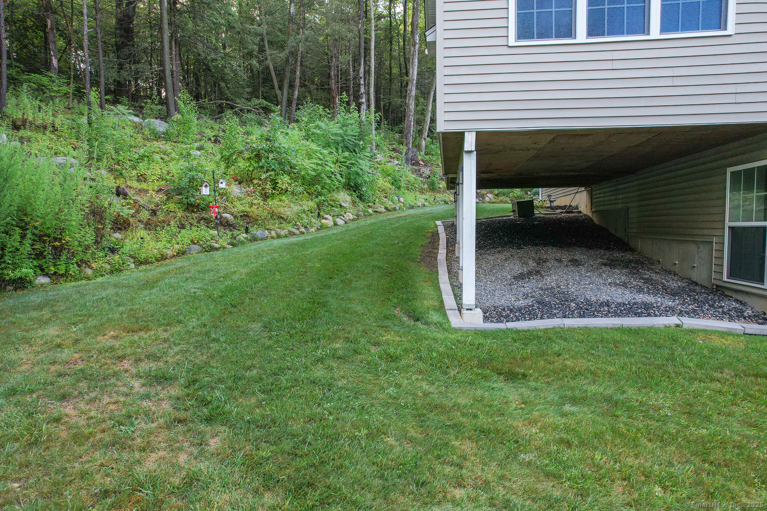 29 Hannah Way Harwinton, CT 06791 - Photo 32 of 34 a view of backyard with table and chairs and potted plants