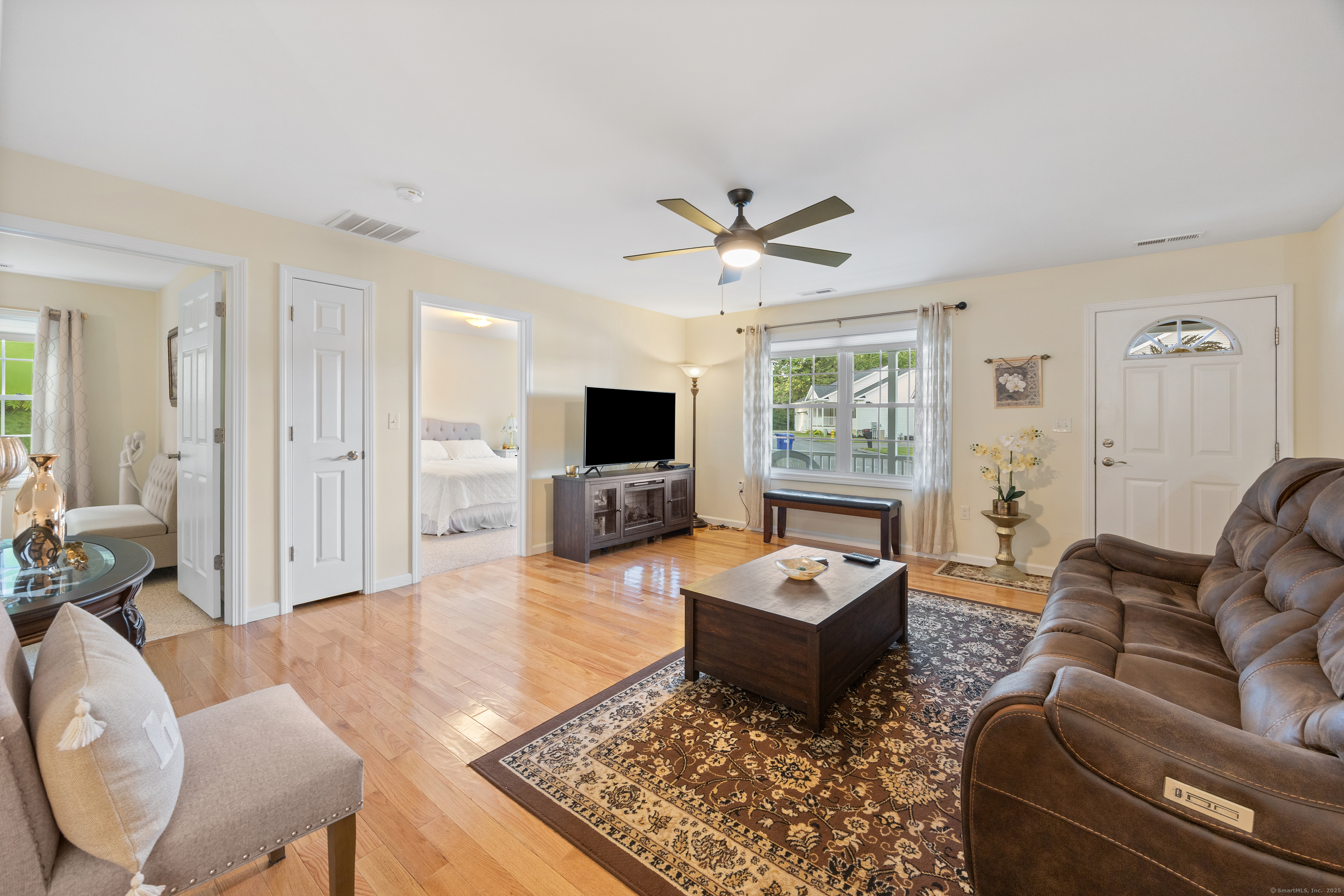 29 Hannah Way Harwinton, CT 06791 - Photo 5 of 34 a living room with furniture a flat screen tv and a large window
