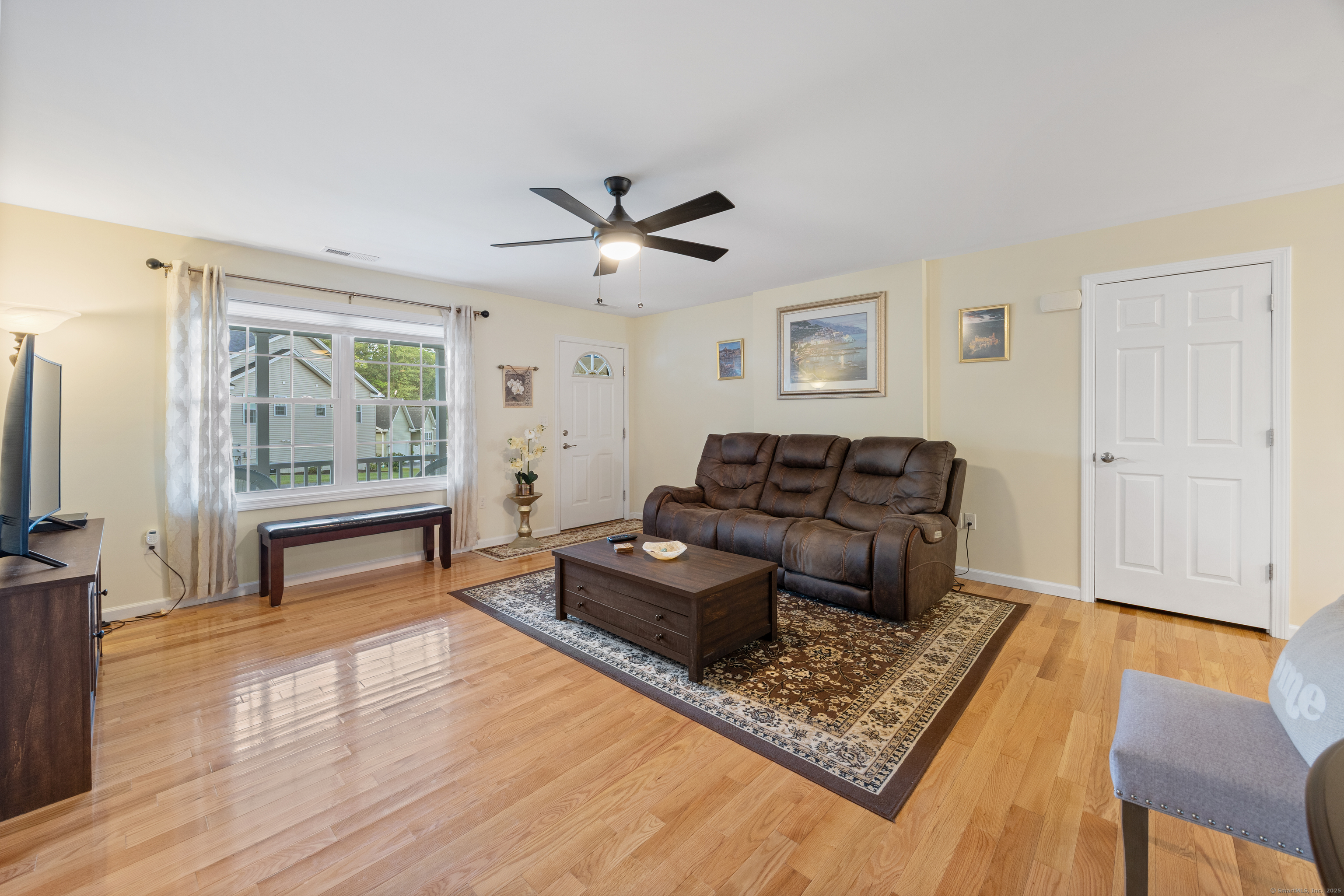 29 Hannah Way Harwinton, CT 06791 - Photo 7 of 34 a living room with furniture and a flat screen tv