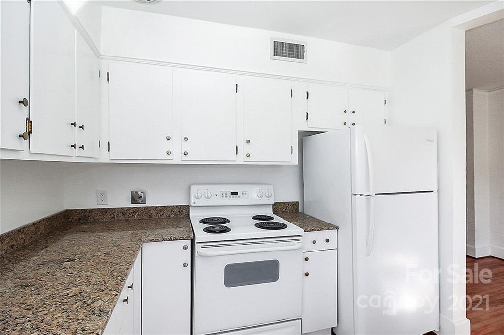 4230 Randolph Road Charlotte, NC 28211 - Photo 14 of 31 a white refrigerator freezer sitting inside of a kitchen