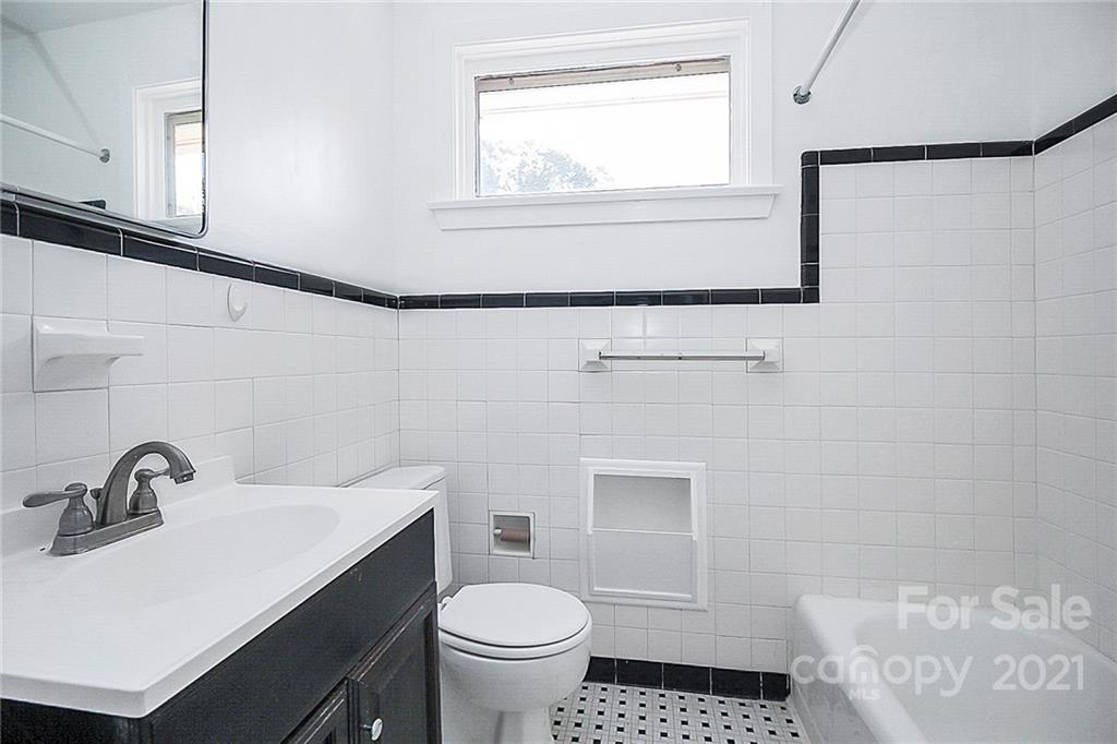 4230 Randolph Road Charlotte, NC 28211 - Photo 18 of 31 a bathroom with a sink toilet a mirror and shower