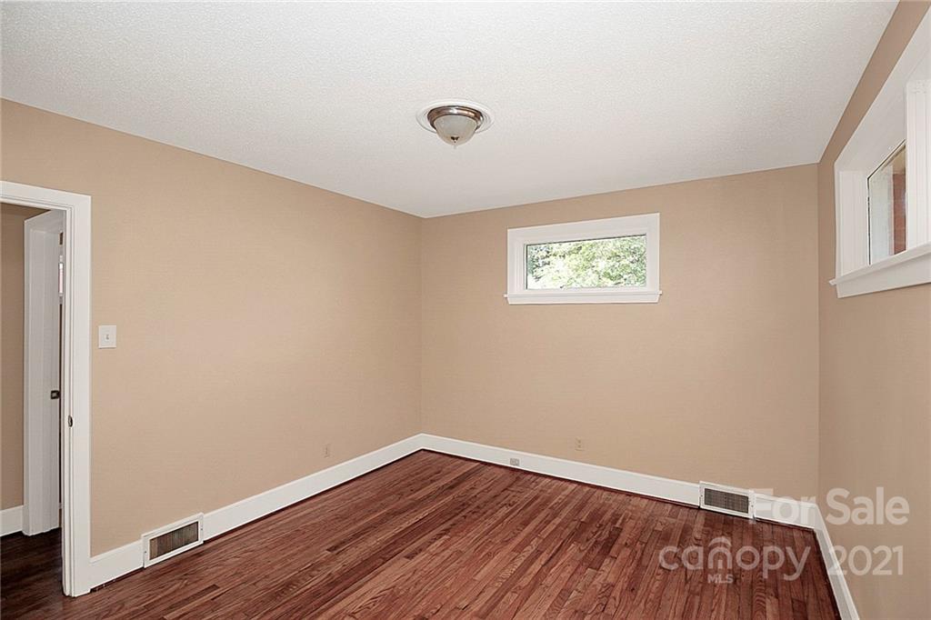 4230 Randolph Road Charlotte, NC 28211 - Photo 24 of 31 an empty room with wooden floor and windows