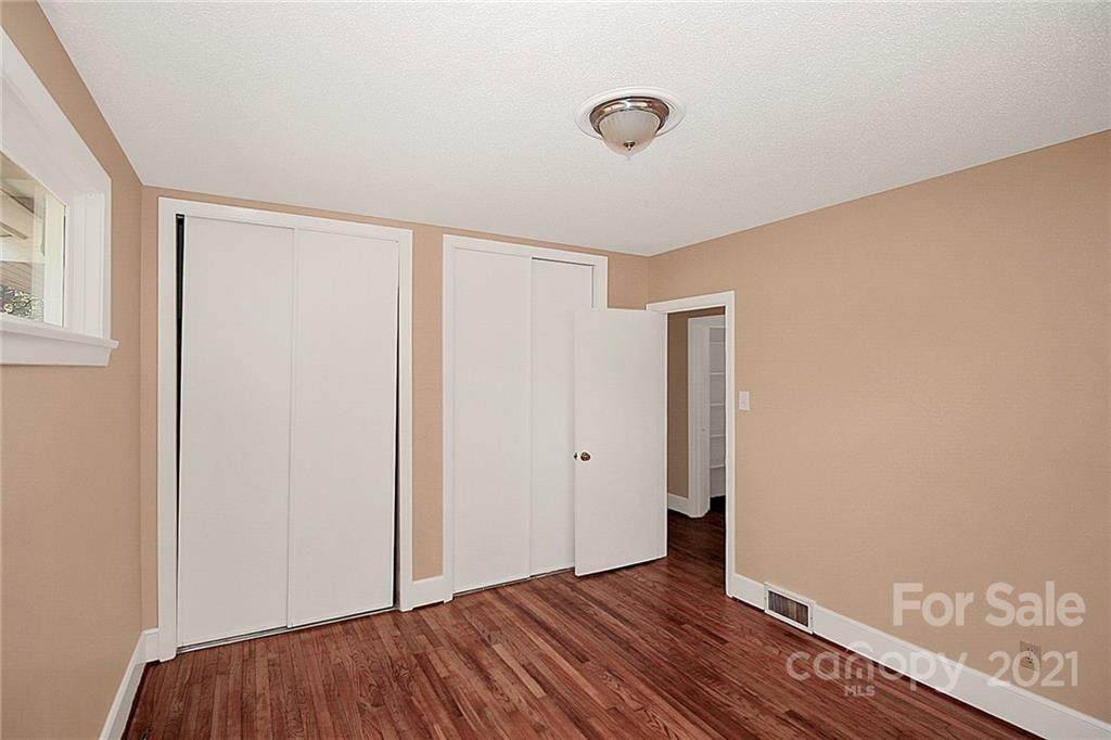 4230 Randolph Road Charlotte, NC 28211 - Photo 25 of 31 an empty room with wooden floor and windows
