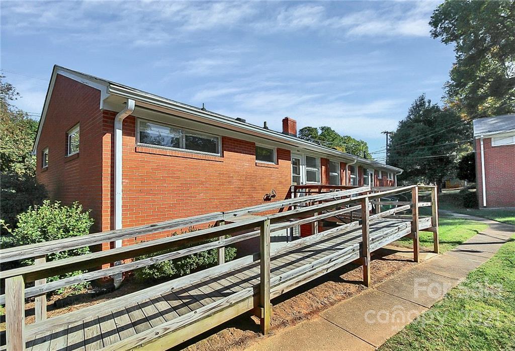 4230 Randolph Road Charlotte, NC 28211 - Photo 29 of 31 a blue bench sitting in front of a house