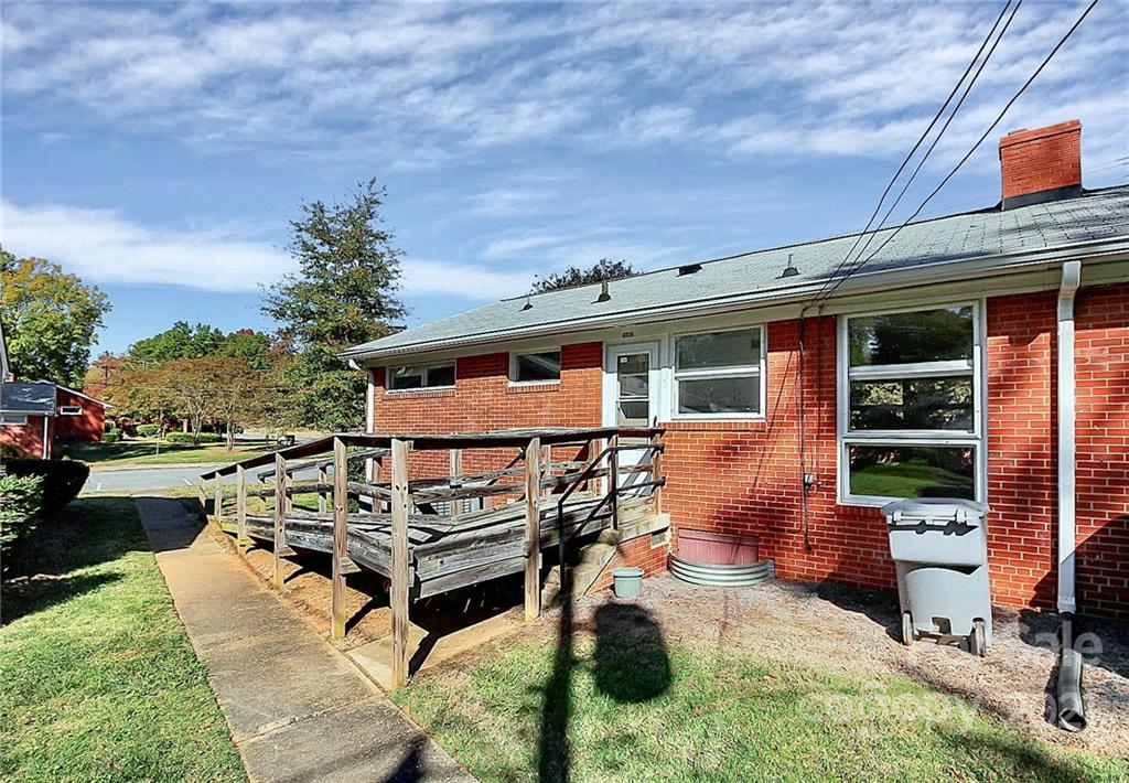 4230 Randolph Road Charlotte, NC 28211 - Photo 31 of 31 a roof deck with table and chairs and potted plants