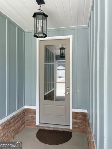 a view of a hallway view with staircase