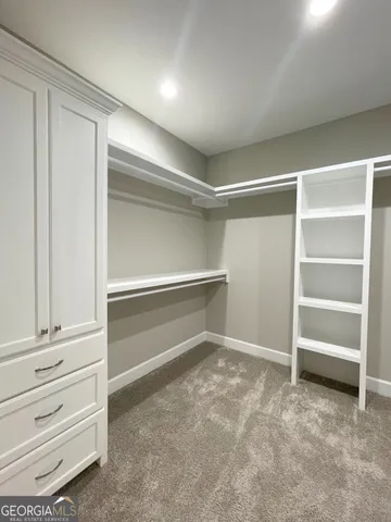a view of an empty walk in closet
