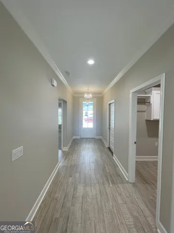 a view of gallery with wooden floor