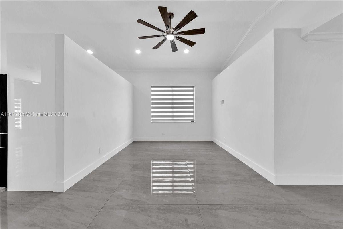 2373 Southwest 177th Terrace Miramar, FL 33029 - Photo 21 of 79 wooden floor in an empty room with a window
