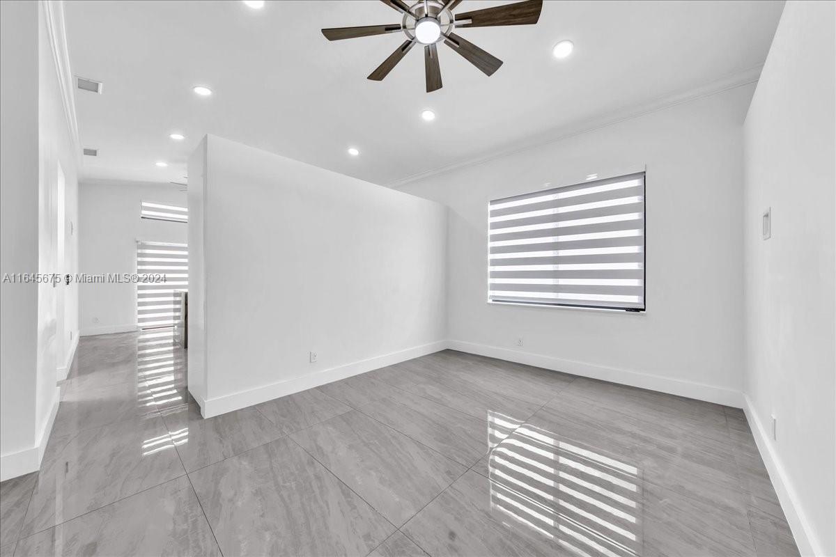 2373 Southwest 177th Terrace Miramar, FL 33029 - Photo 22 of 79 a view of an empty room with a window