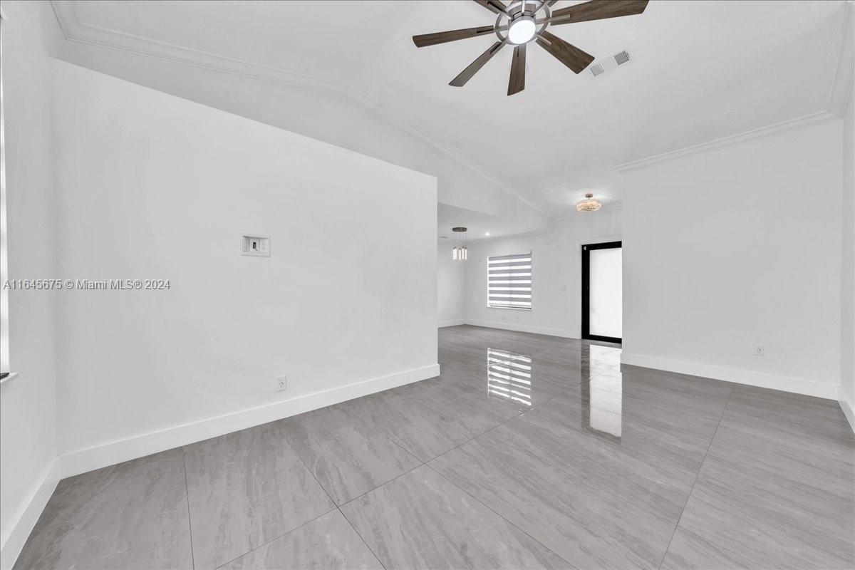 2373 Southwest 177th Terrace Miramar, FL 33029 - Photo 24 of 79 a view of an empty room with a window and wooden floor