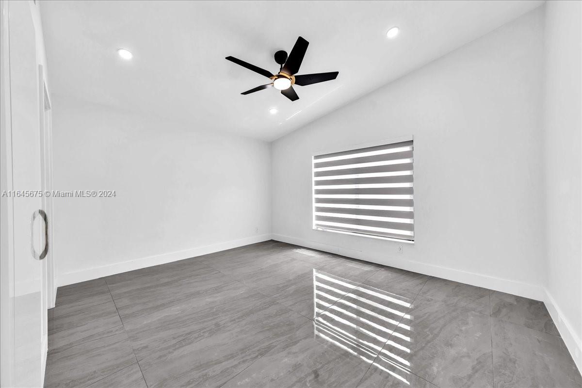 2373 Southwest 177th Terrace Miramar, FL 33029 - Photo 25 of 79 a view of a livingroom with a ceiling fan & window