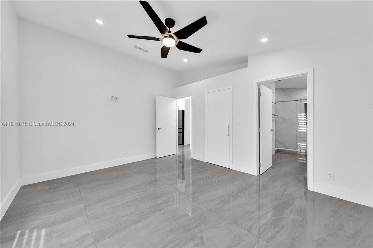 2373 Southwest 177th Terrace Miramar, FL 33029 - Photo 27 of 79 an empty room with closet and a ceiling fan