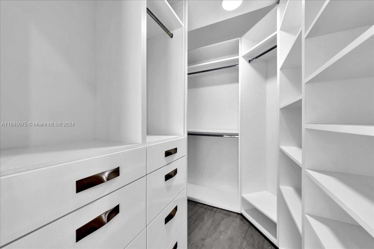 2373 Southwest 177th Terrace Miramar, FL 33029 - Photo 30 of 79 a view of walk in closet with empty racks