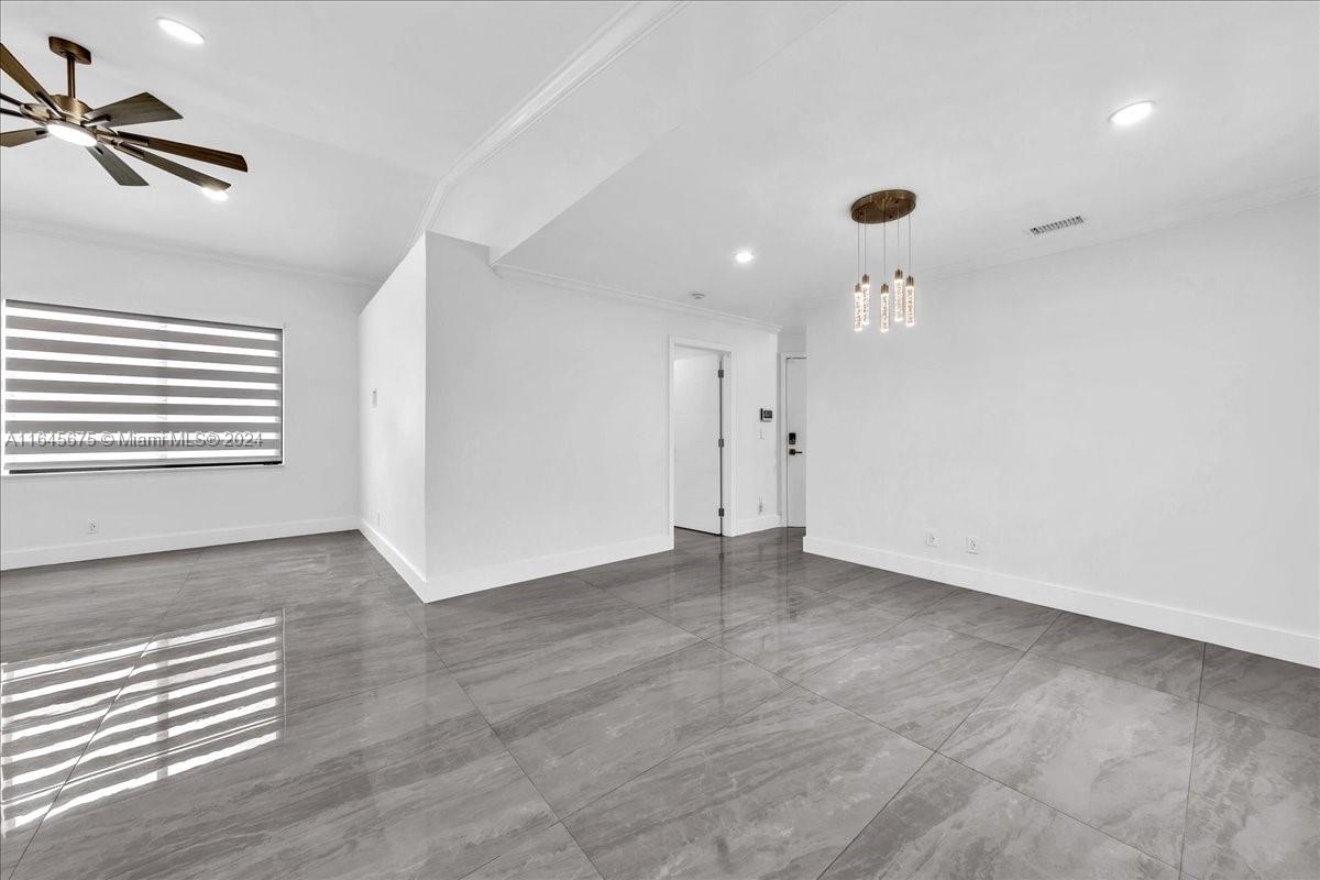 2373 Southwest 177th Terrace Miramar, FL 33029 - Photo 3 of 79 wooden floor in an empty room with a window