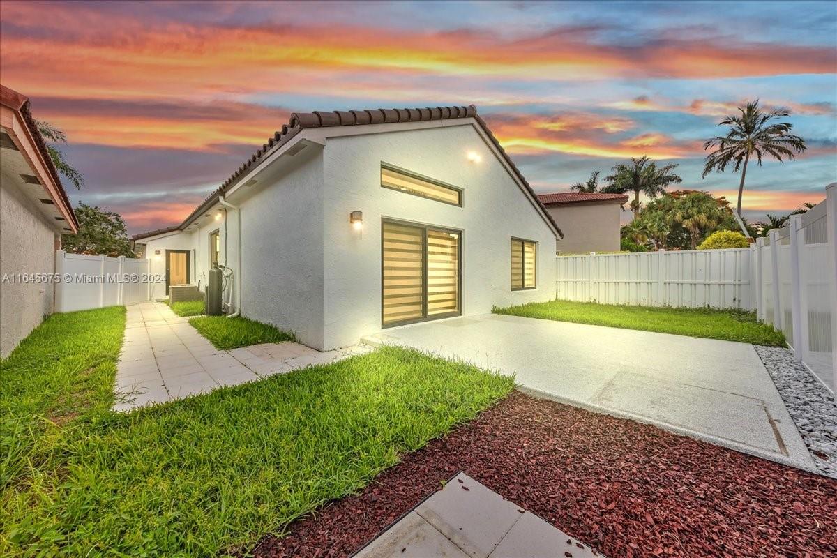 2373 Southwest 177th Terrace Miramar, FL 33029 - Photo 58 of 79 a view of a house with a yard