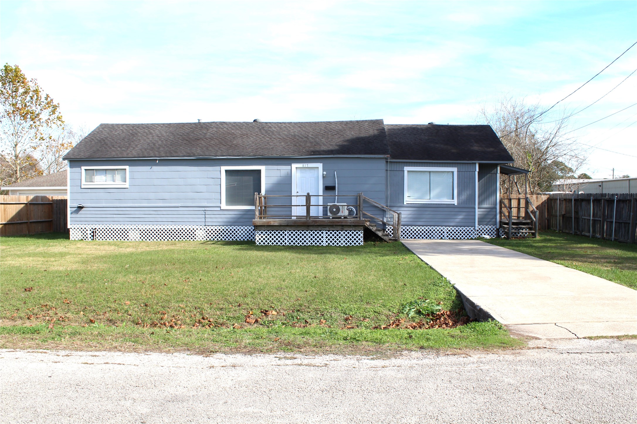 817 Hudler Street La Marque, TX 77568 - Photo 1 of 43 a front view of a house with a garden and yard