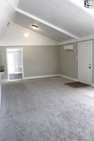 a kitchen with stainless steel appliances granite countertop a sink a stove a microwave and a refrigerator