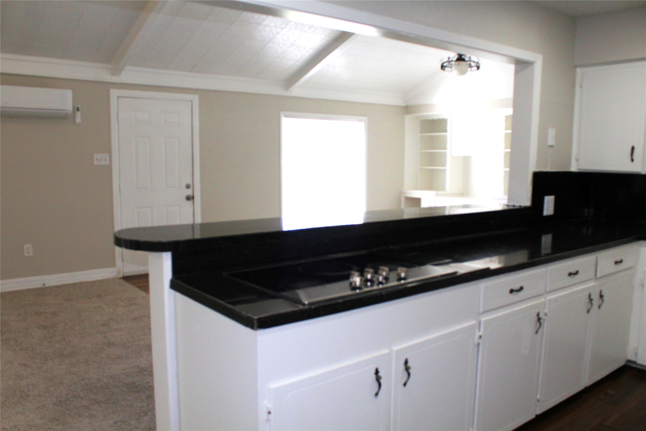 817 Hudler Street La Marque, TX 77568 - Photo 22 of 43 a kitchen with granite countertop a sink cabinets and window