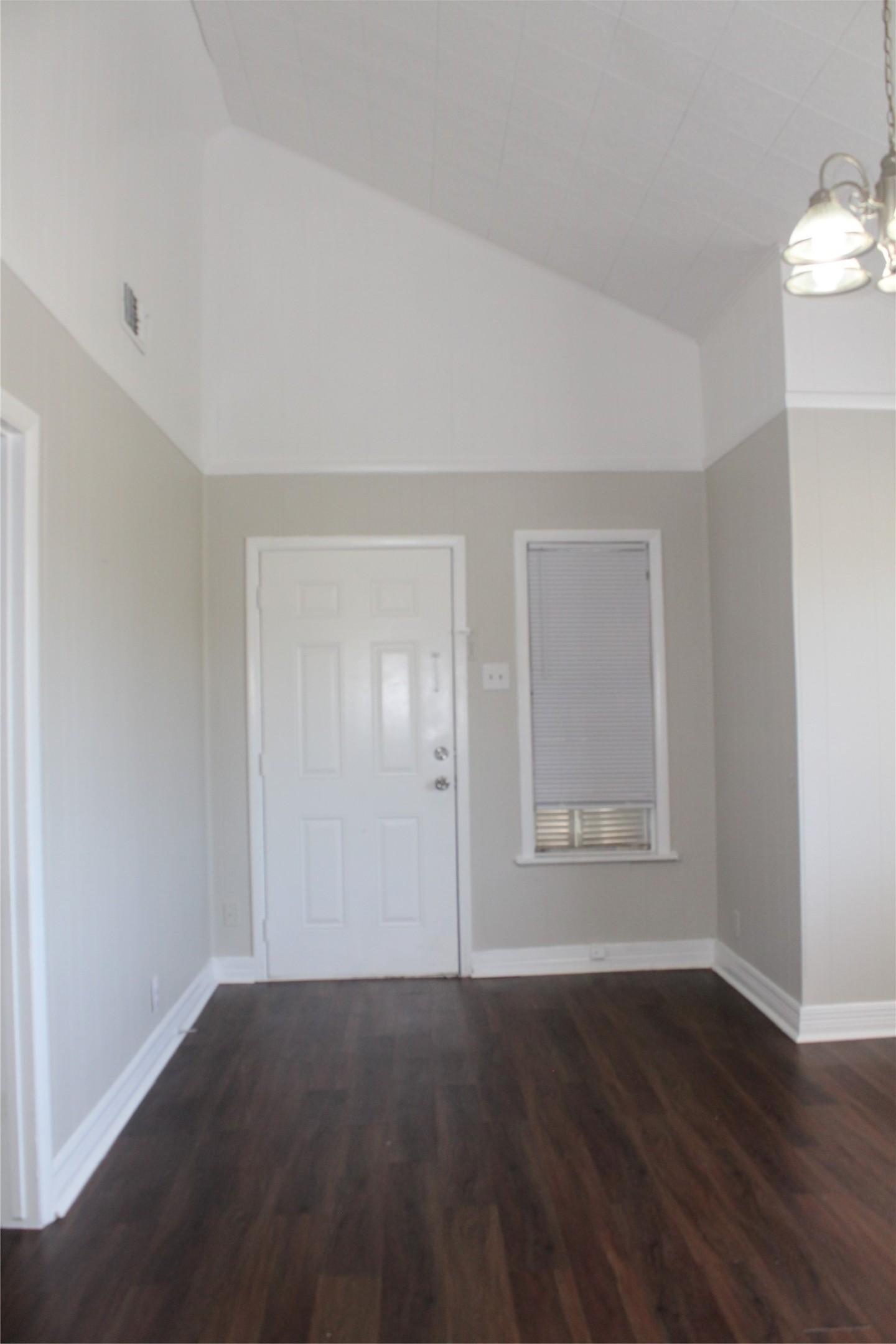 817 Hudler Street La Marque, TX 77568 - Photo 26 of 43 an empty room with wooden floor and windows