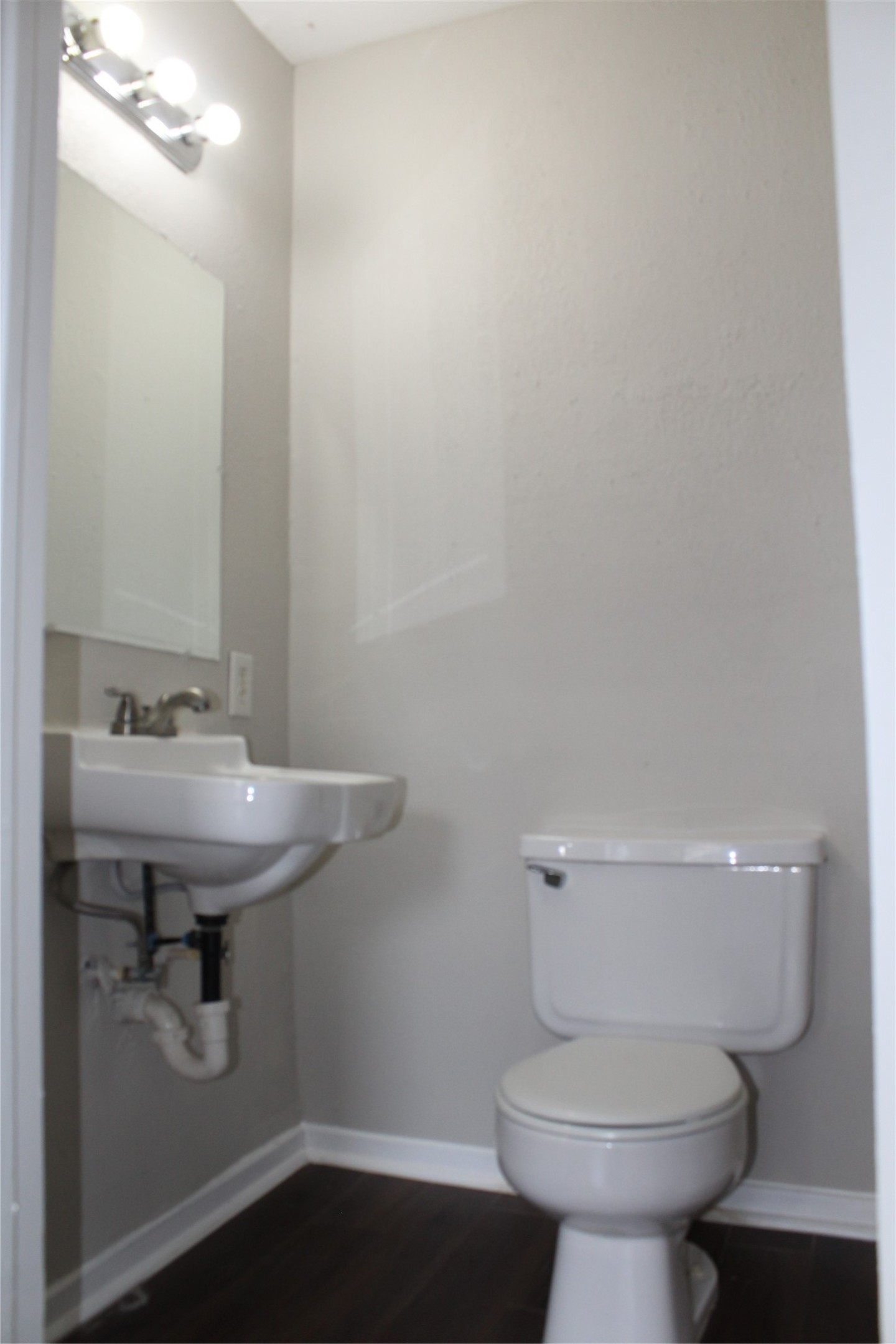 817 Hudler Street La Marque, TX 77568 - Photo 29 of 43 a bathroom with a sink toilet and a mirror