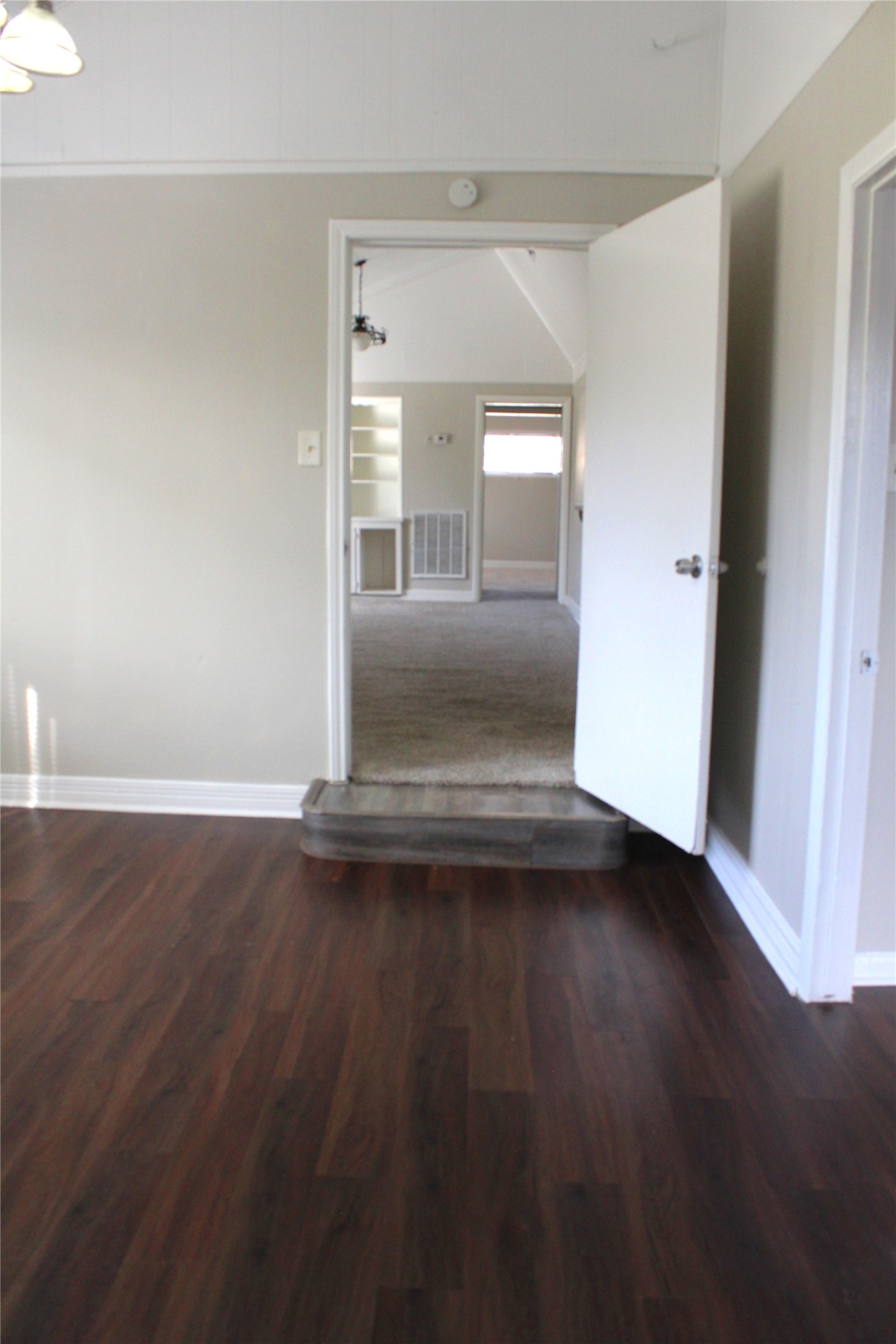 817 Hudler Street La Marque, TX 77568 - Photo 32 of 43 an empty room with wooden floor and windows