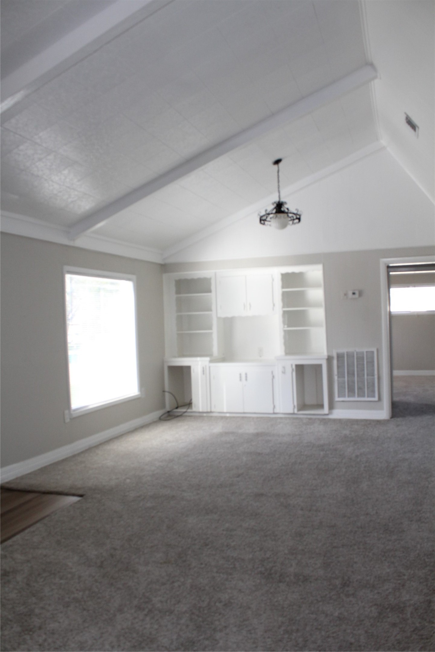 817 Hudler Street La Marque, TX 77568 - Photo 33 of 43 an empty room with windows and ceiling fan