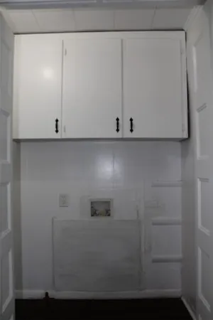 an empty room that has a window in it