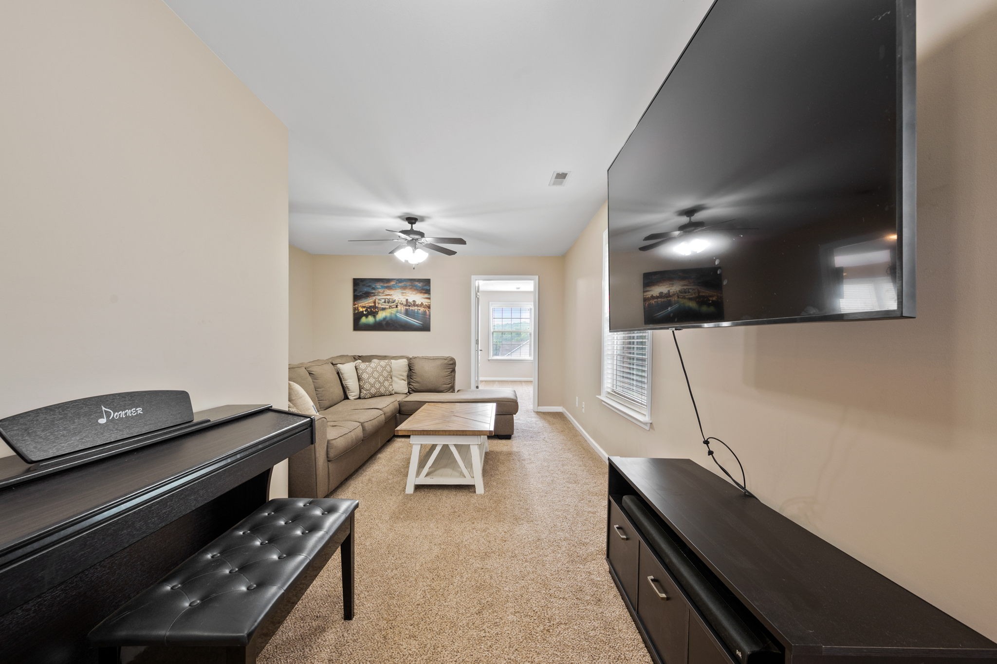 436 Marilyn Circle Spring Hill, TN 37174 - Photo 14 of 25 a living room with furniture and a flat screen tv