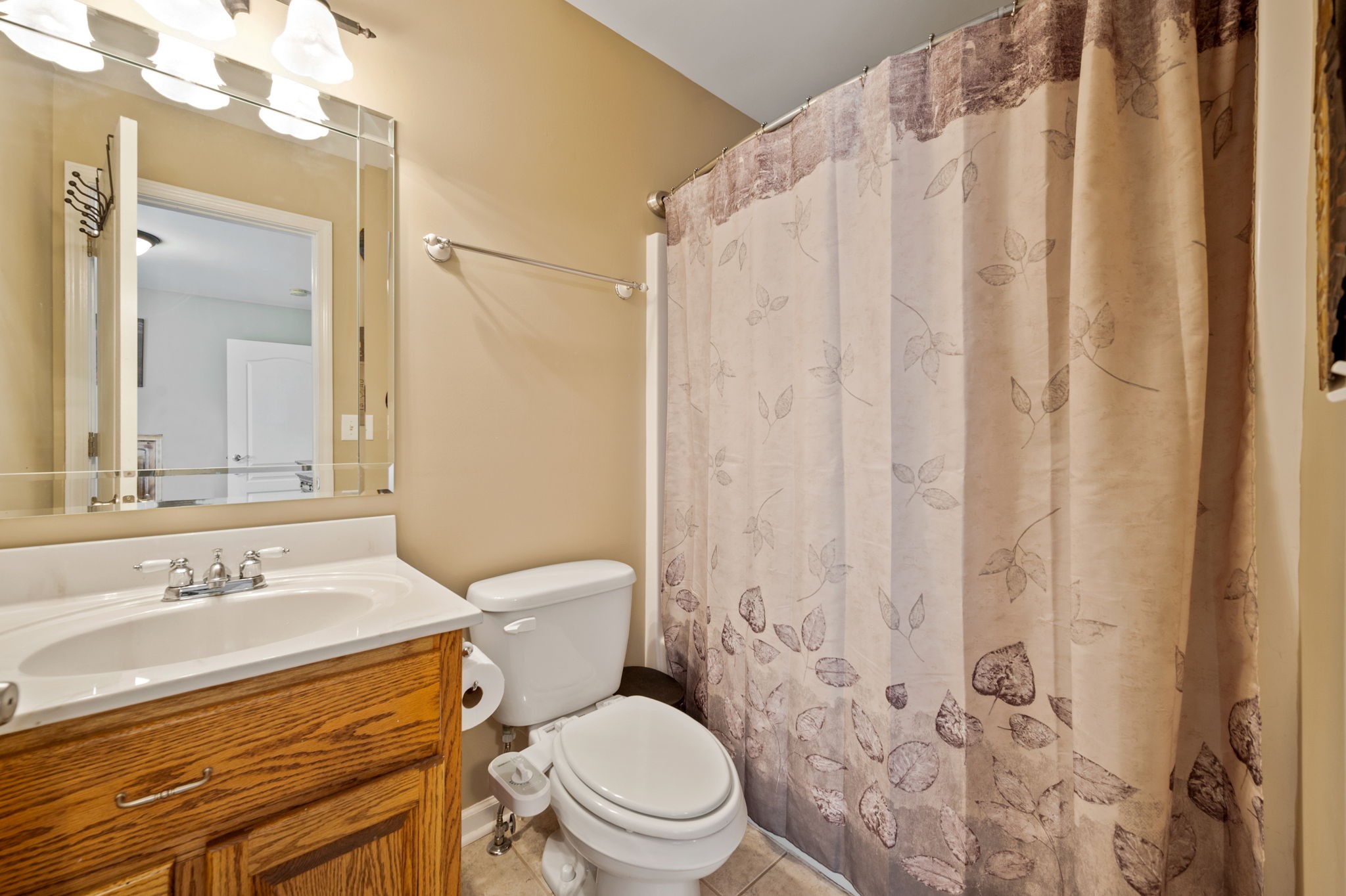 436 Marilyn Circle Spring Hill, TN 37174 - Photo 19 of 25 a bathroom with a sink a toilet and shower curtain