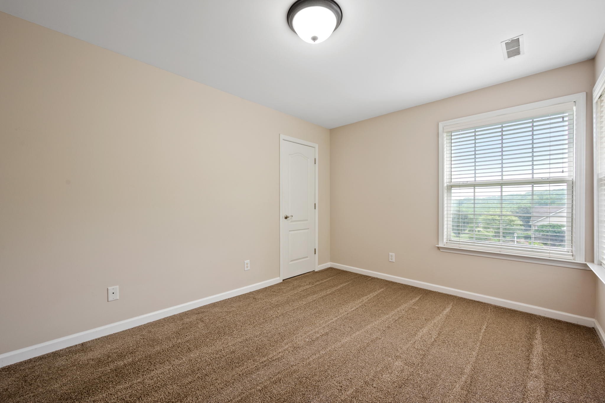 436 Marilyn Circle Spring Hill, TN 37174 - Photo 20 of 25 an empty room with a empty space and a window