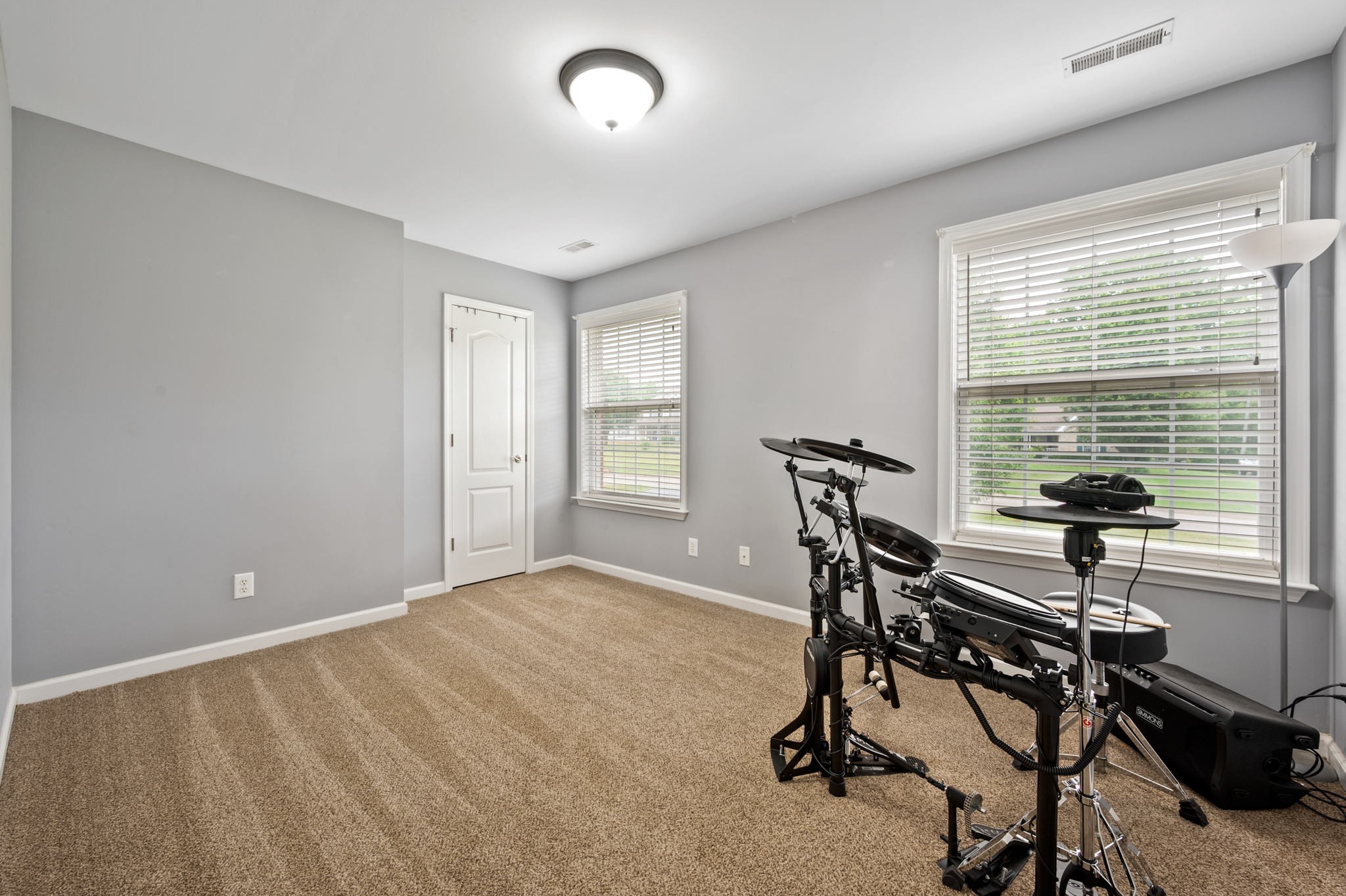 436 Marilyn Circle Spring Hill, TN 37174 - Photo 22 of 25 a view of a room with gym equipment and windows