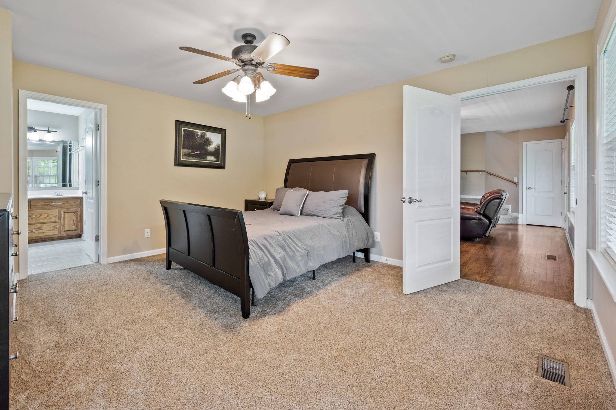 436 Marilyn Circle Spring Hill, TN 37174 - Photo 10 of 25 a spacious bedroom with a bed and a chandelier