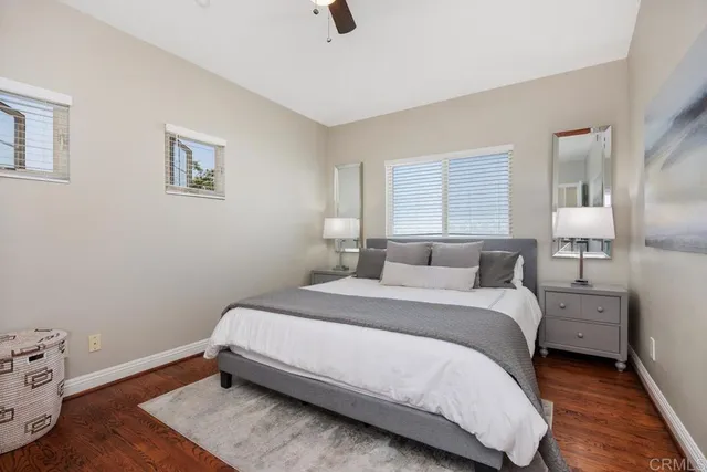 a bedroom with a bed and lamp