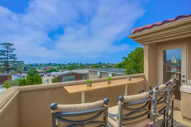 a view of a chairs and table in the terrace