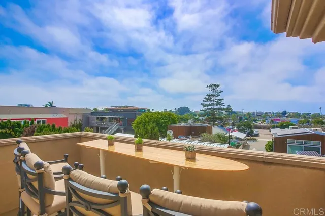 a view of swimming pool with outdoor seating and city view