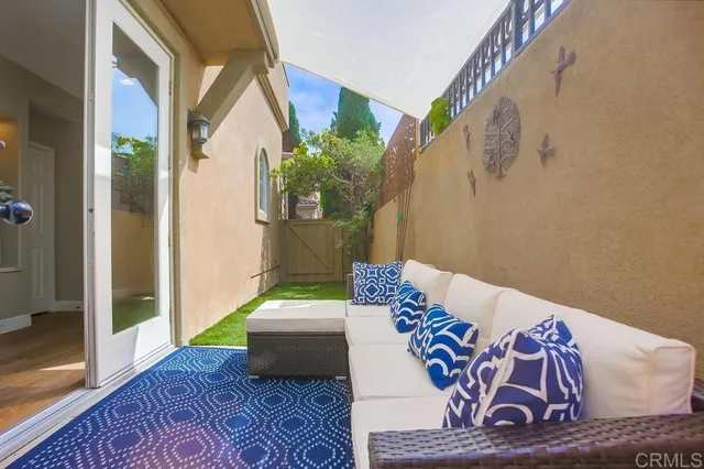 a living room with furniture and a rug