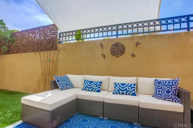 a blue couch sitting next to a blue wall