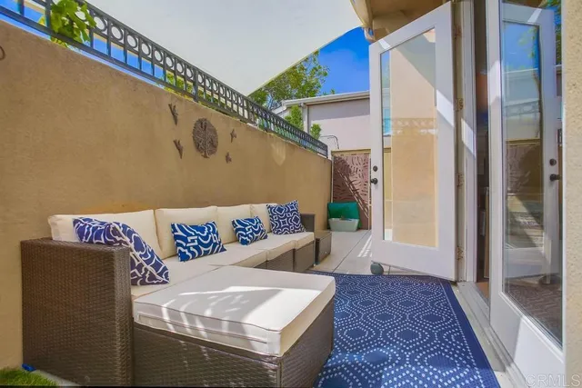 a living room with a couch and a rug