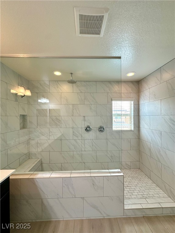 9527 Ridgeglen Court Las Vegas, NV 89148 - Photo 27 of 30 Bathroom with a textured ceiling, a walk in shower, wood finished floors, recessed lighting, and vanity