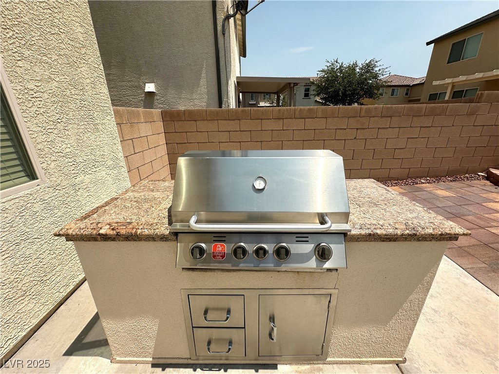 9527 Ridgeglen Court Las Vegas, NV 89148 - Photo 29 of 30 View of patio featuring an outdoor kitchen