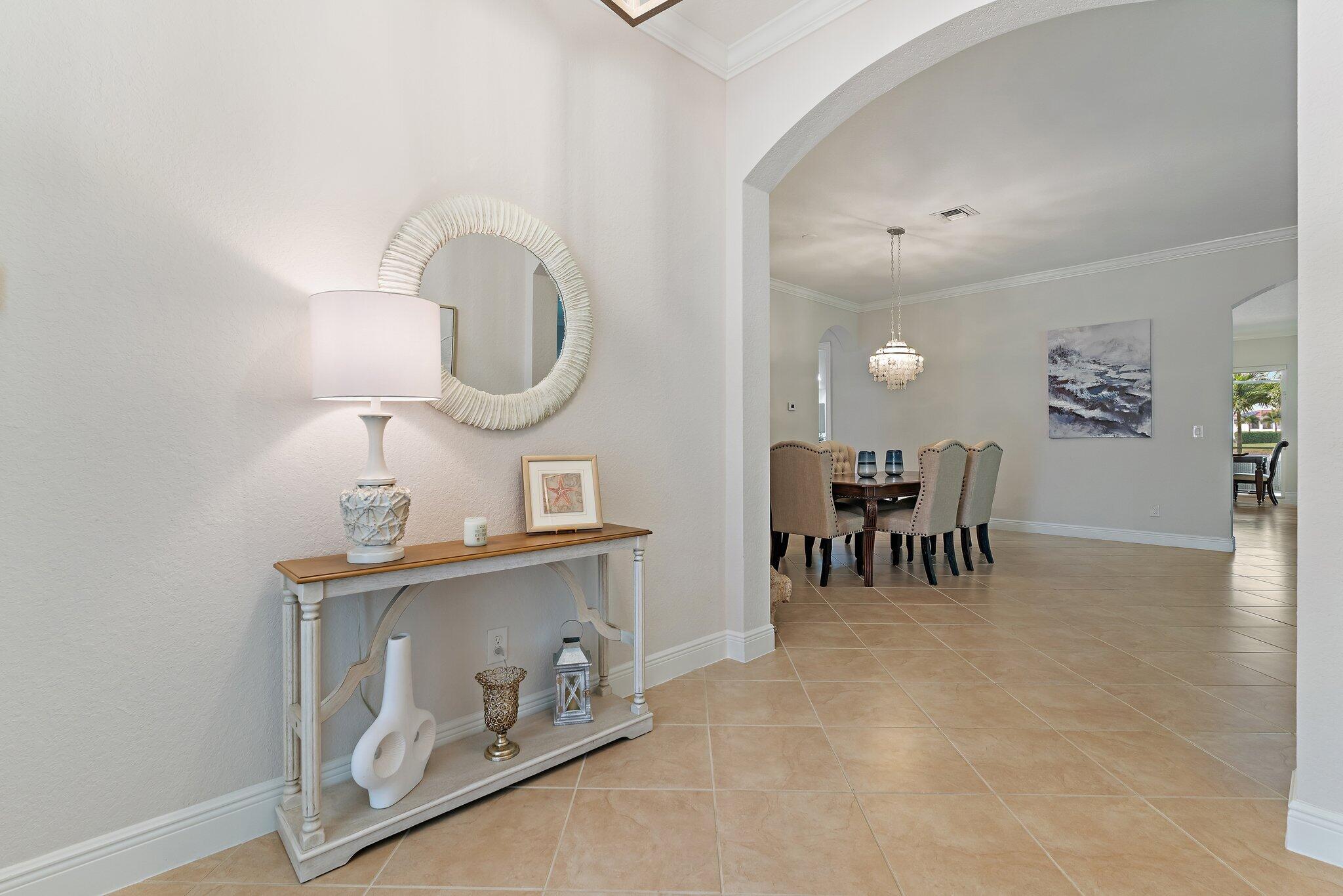 266 Rudder Cay Way Jupiter, FL 33458 - Photo 21 of 79 a dining room with furniture and a chandelier