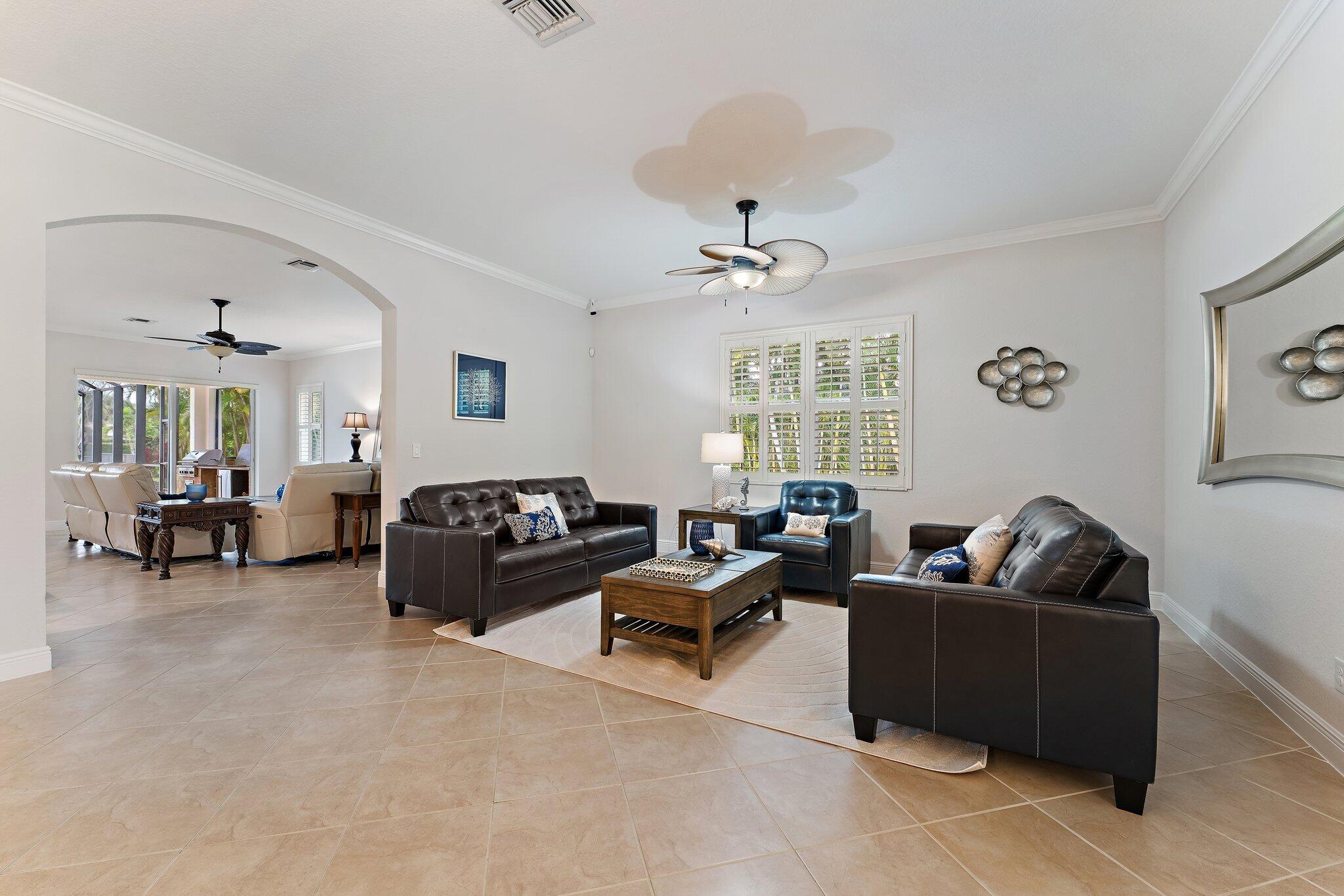 266 Rudder Cay Way Jupiter, FL 33458 - Photo 22 of 79 a living room with furniture and a window