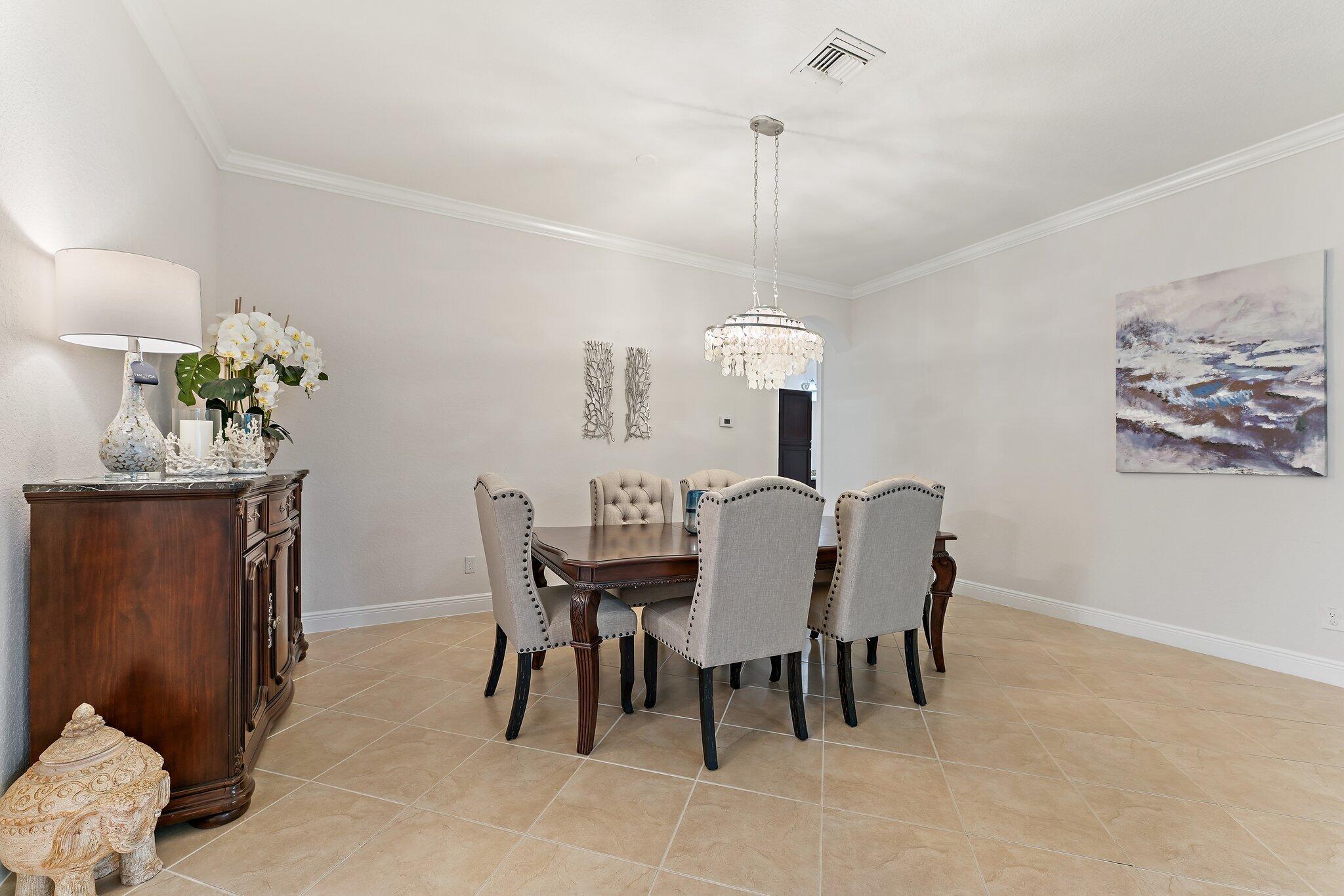 266 Rudder Cay Way Jupiter, FL 33458 - Photo 23 of 79 a view of a dining room with furniture