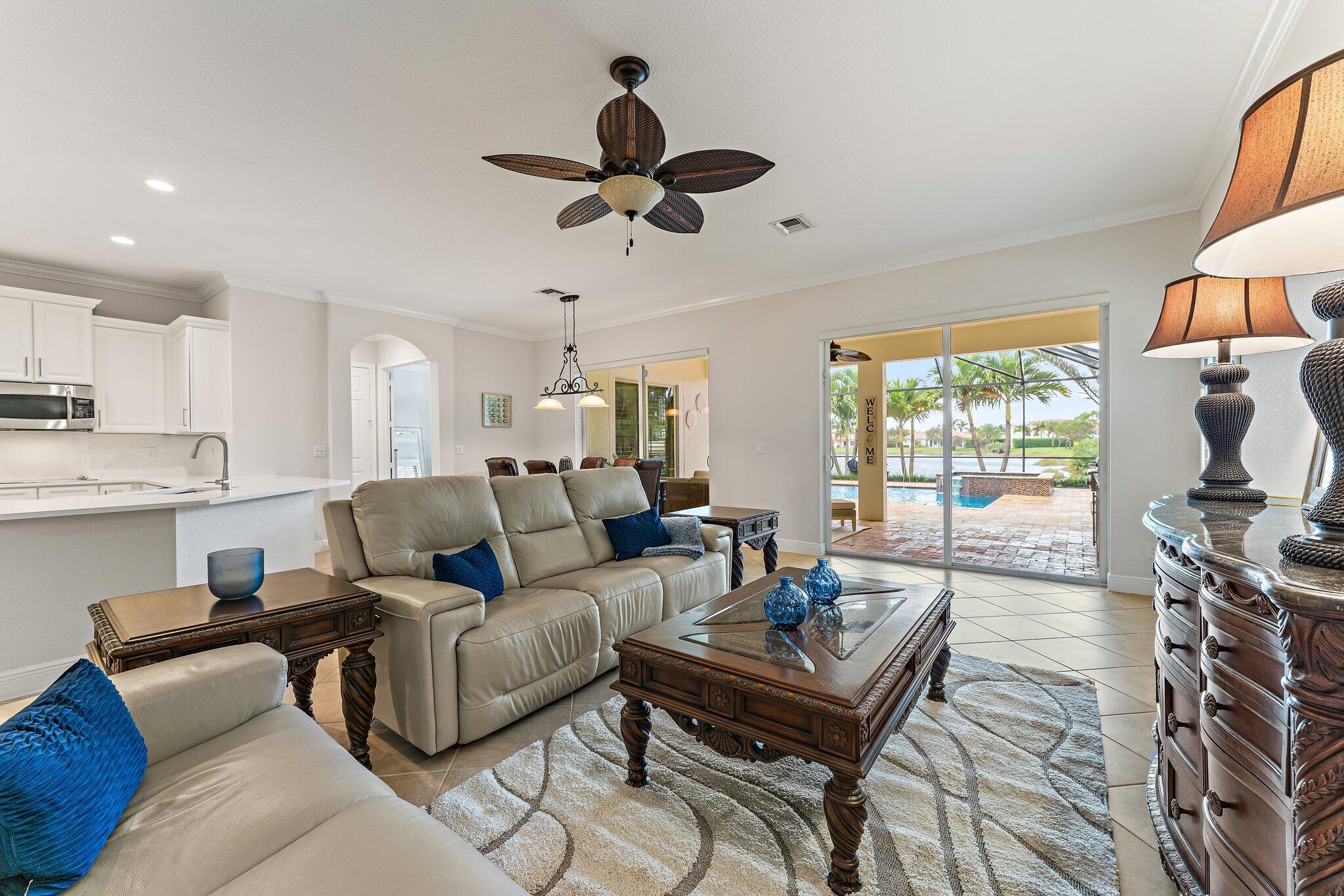 266 Rudder Cay Way Jupiter, FL 33458 - Photo 27 of 79 a living room with furniture and a large window