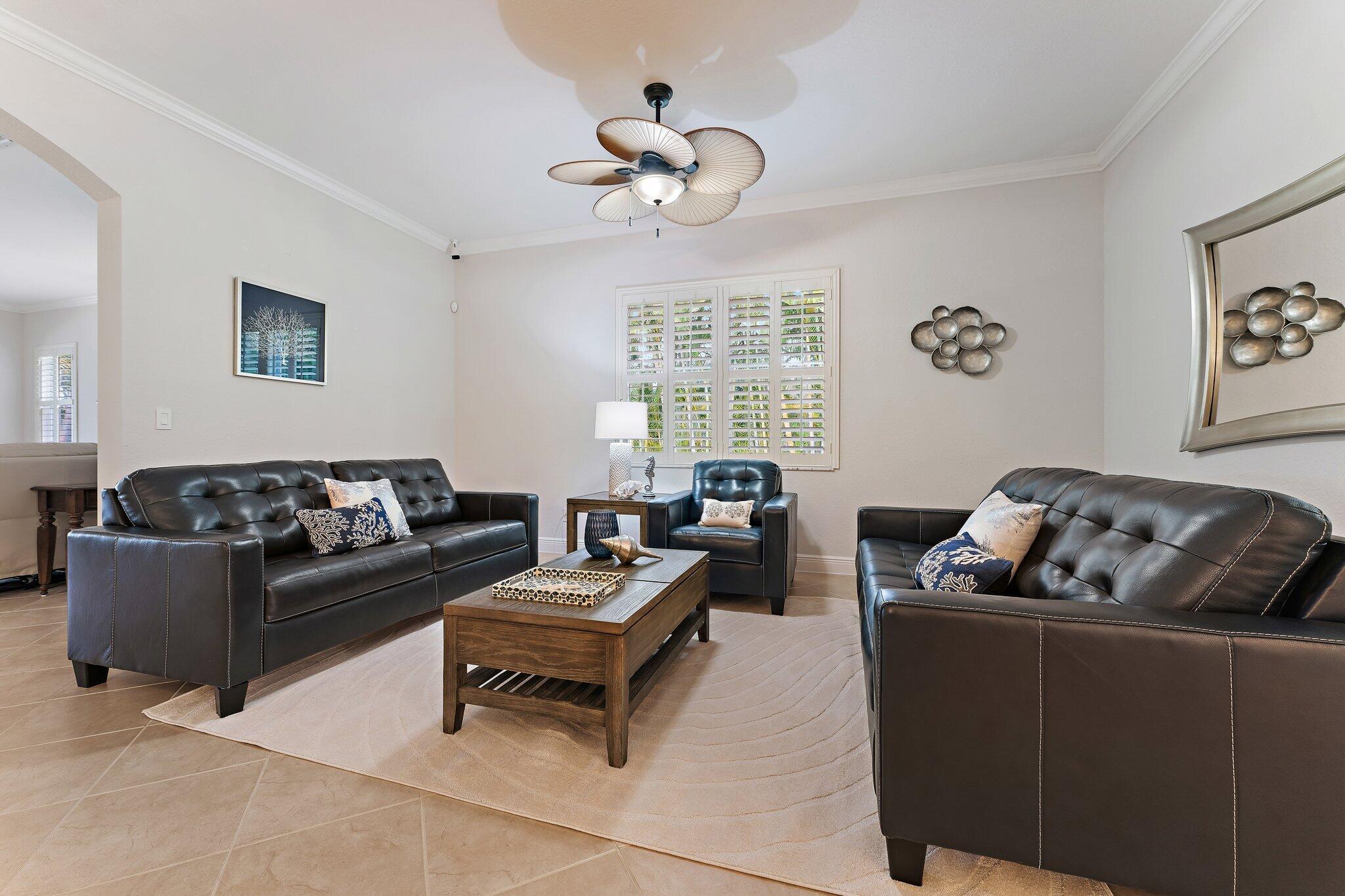 266 Rudder Cay Way Jupiter, FL 33458 - Photo 28 of 79 a living room with furniture and a large window