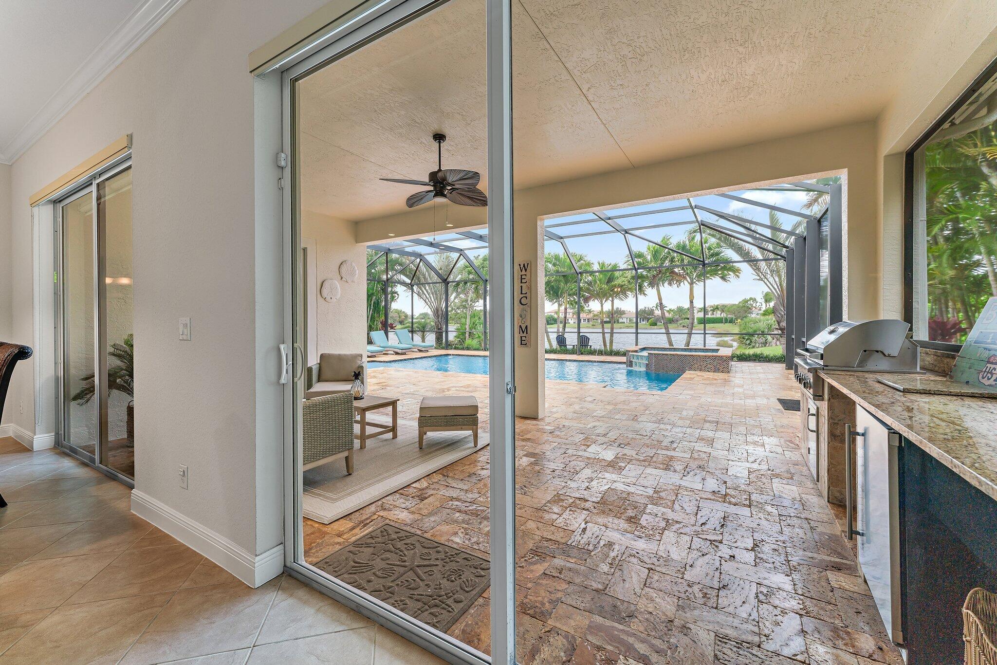266 Rudder Cay Way Jupiter, FL 33458 - Photo 3 of 79 a view of a living room and a floor to ceiling window