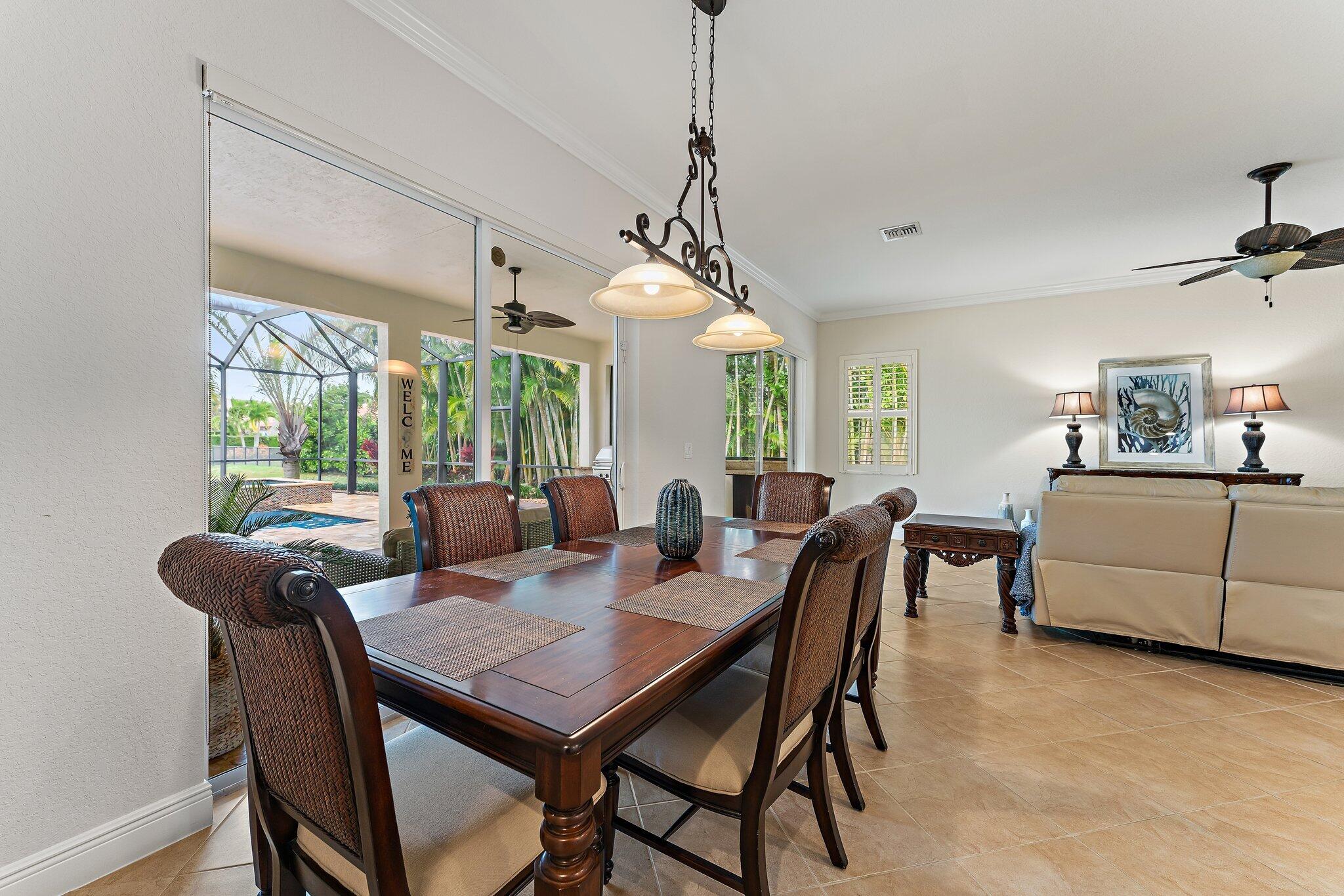 266 Rudder Cay Way Jupiter, FL 33458 - Photo 33 of 79 a view of a dining room with furniture window and outside view