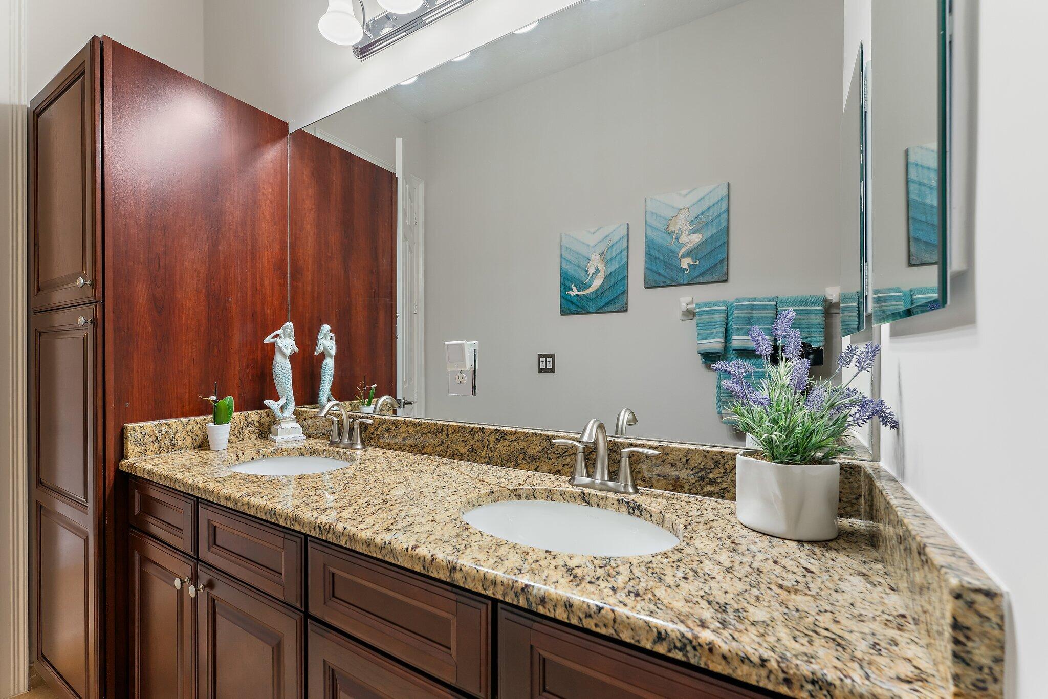 266 Rudder Cay Way Jupiter, FL 33458 - Photo 50 of 79 a bathroom with a granite countertop sink and a mirror