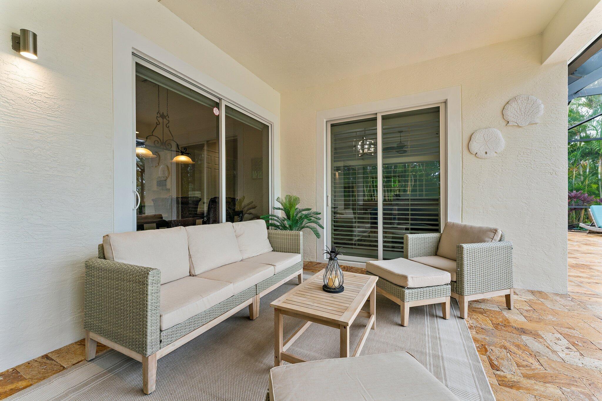 266 Rudder Cay Way Jupiter, FL 33458 - Photo 52 of 79 a living room with furniture and a large window